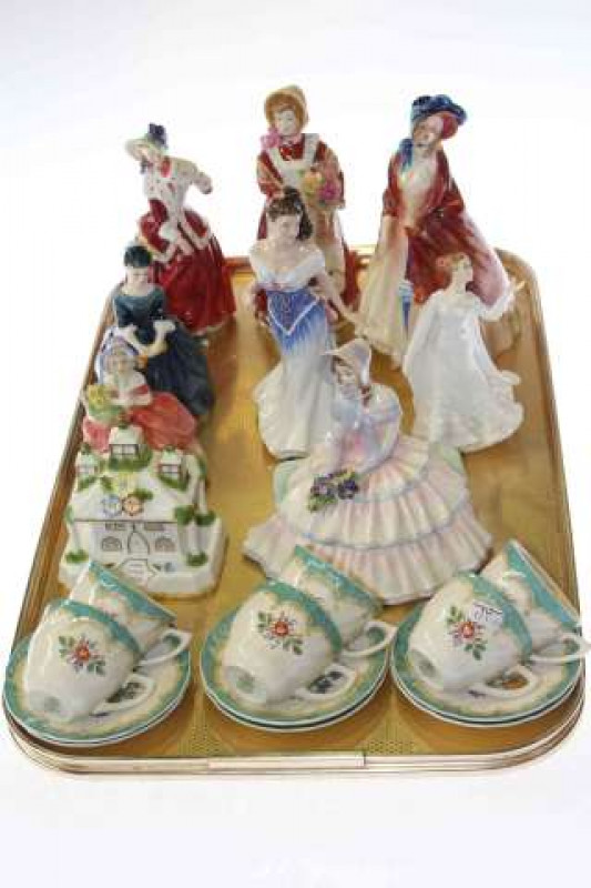 Six Royal Doulton figures, two Dickensian figures, Coalport 'Park Lodge' cottage and six Doulton Kingswood coffee cups and saucers
