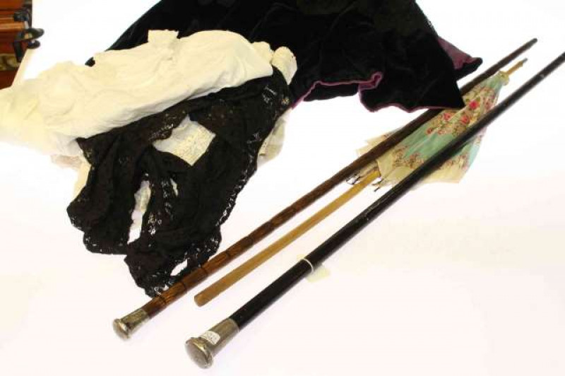 Two silver topped walking canes, parasol and vintage clothing