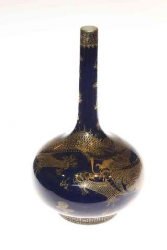 Oriental bottle neck vase with gilt dragon design on rich blue ground, 40cm high