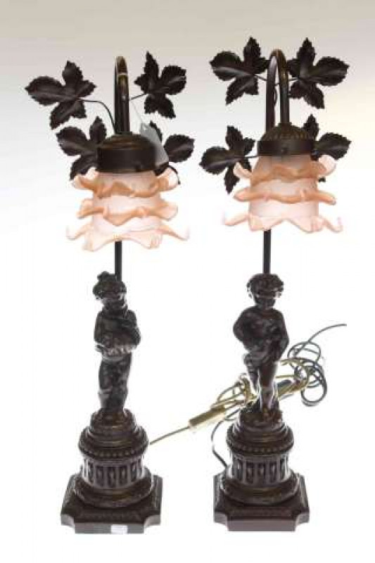 Pair of metal cherub design table lamps with pink petal style shades