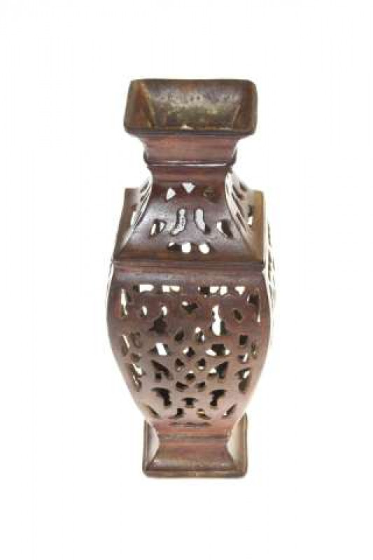 Patinated metal pierced vase