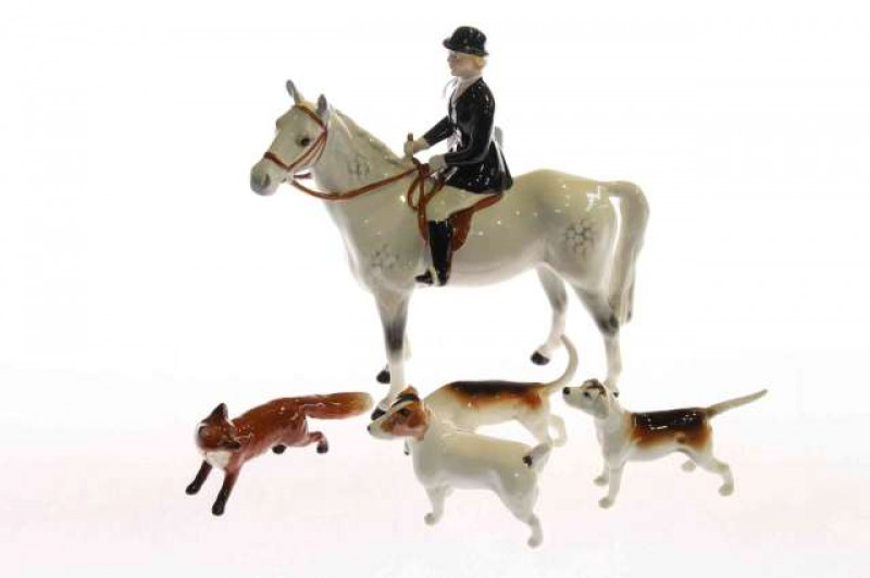 Beswick model of a huntswoman on a grey horse, two Beswick hounds, Beswick fox and a Beswick terrier (5)