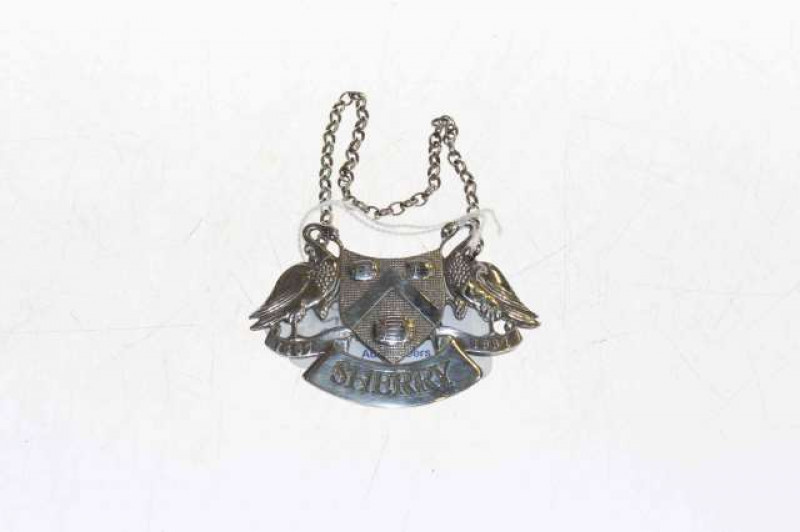 Silver sherry decanter label in the form of a crest