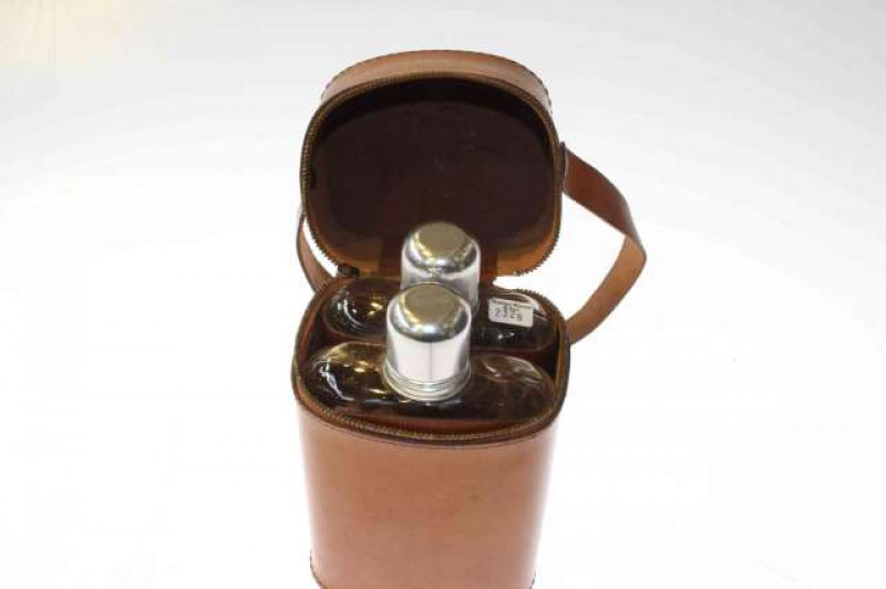 Two vintage hip flasks in a leather case, retains 1952 Shropshire and W. Midland Agricultural Society label