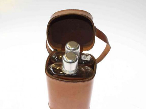 Two vintage hip flasks in a leather case, retains 1952 Shropshire and...
