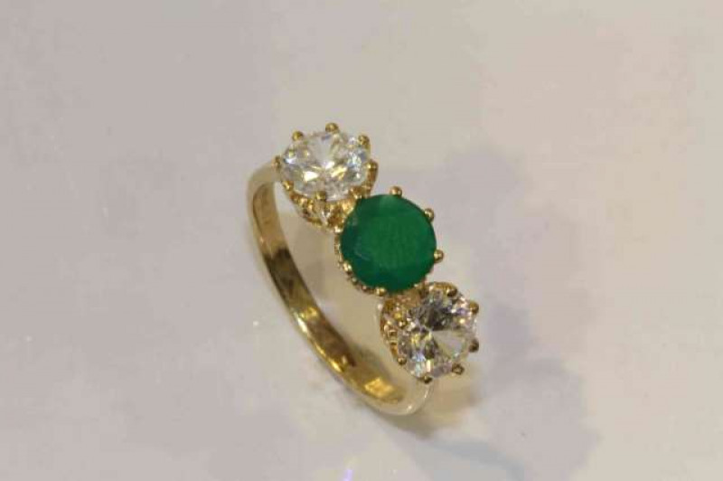 9 carat gold ring set with green and white stones