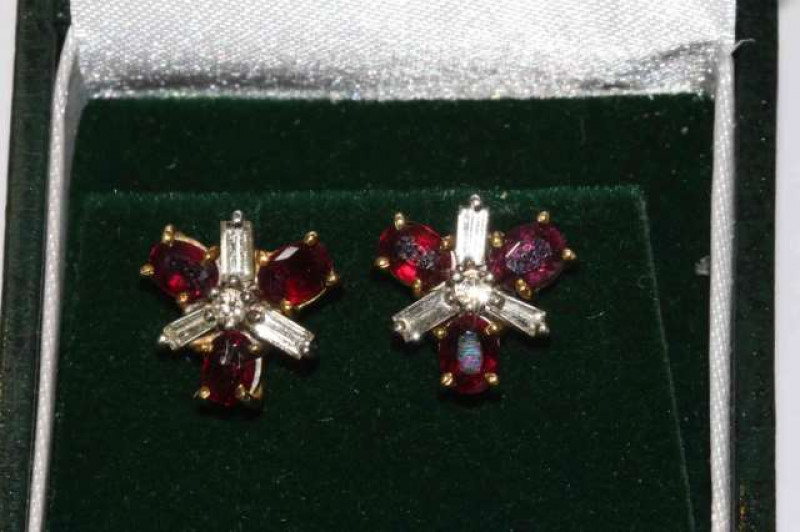 Pair of ruby and diamond cluster earrings, set in 18 carat white and yellow gold