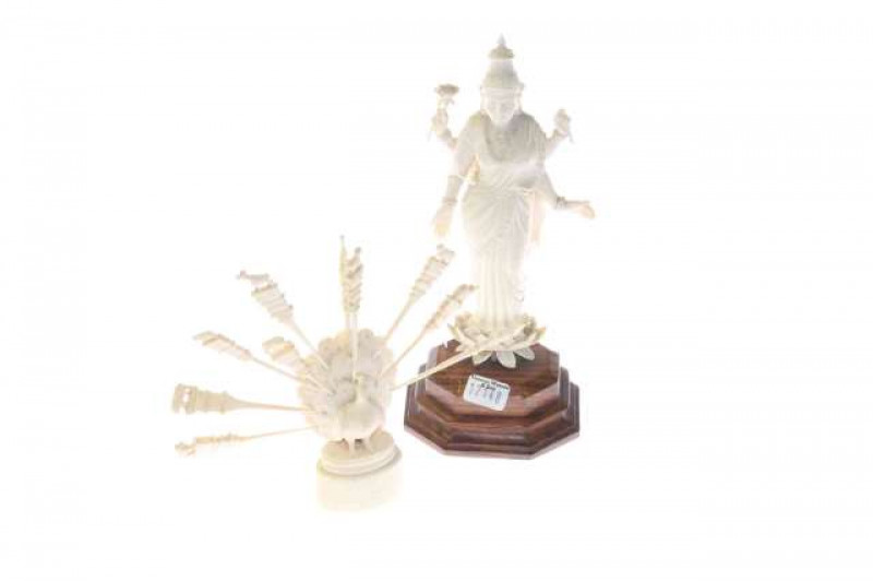 South-East Asian ivory figure of a goddess and an ivory peacock form toothpick stand, early 20th Century (2)