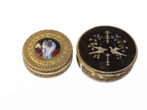 A tortoiseshell, brass and pique work snuff box, circular, the hinged...