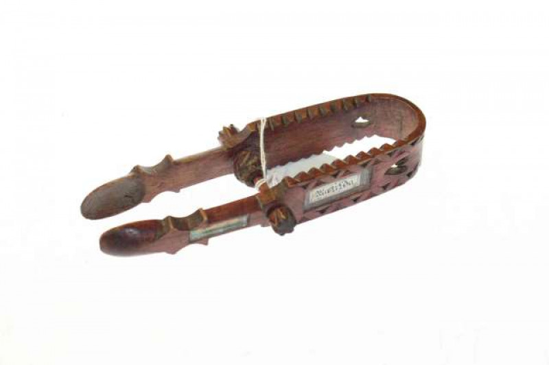 Unusual pair of carved sweetheart sugar nips, dated 1916