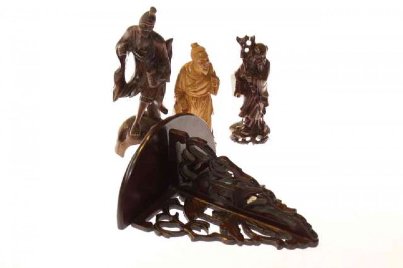 Three Oriental carved figures and a wall bracket (4)
