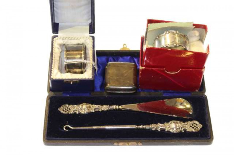 Two silver napkin rings, silver vesta and silver-handled button hook and shoe horn