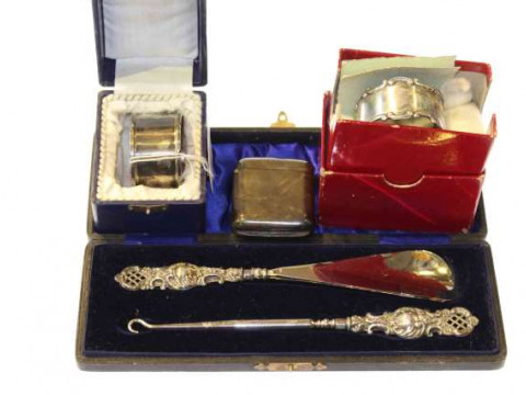 Two silver napkin rings, silver vesta and silver-handled button hook and...