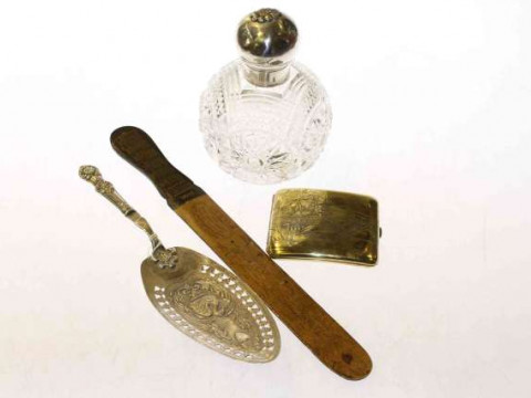Large silver-topped scent bottle, fish slice, page turner and cigarette...
