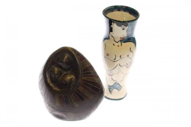 Tribal carving of sloths and Karen Atherley vase