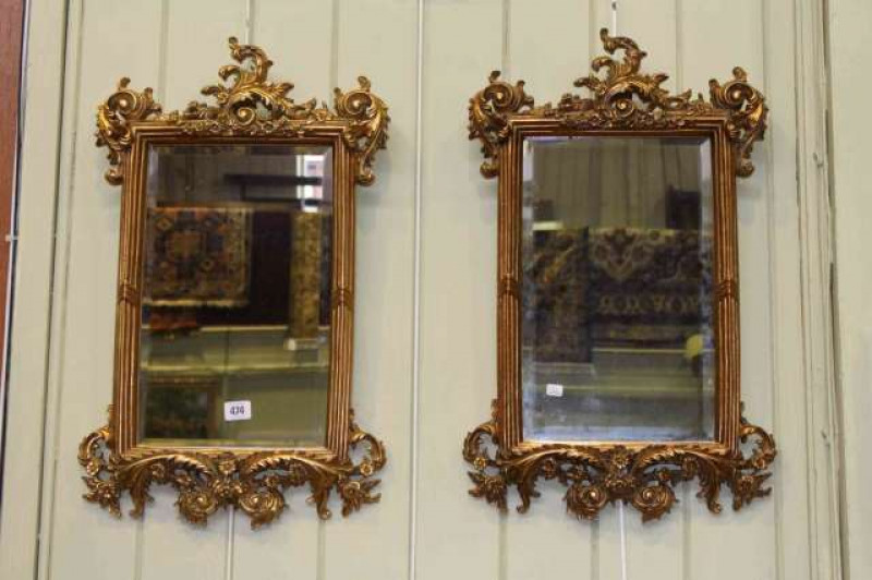 Pair ornate gilt framed rectangular bevelled wall mirrors