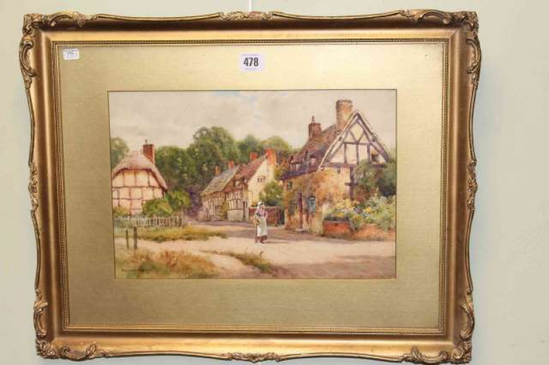 E.W. Haslehurst, Figure Walking by Cottages, signed lower left, watercolour, 23cm x 35cm, in gilt frame