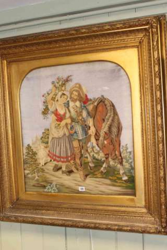 Large 19th Century woolwork panel, depicting a pastoral scene with a cavalier and a maiden, 107cm x 101cm in gilt composition frame