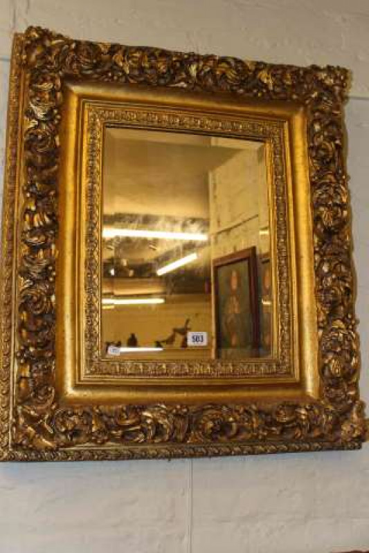 Ornate gilt framed bevelled wall mirror
