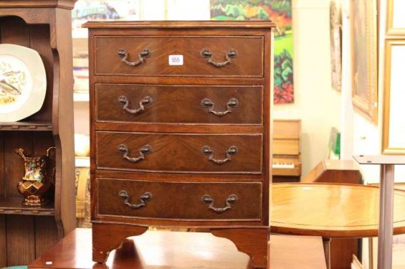 Small mahogany four drawer serpentine front chest