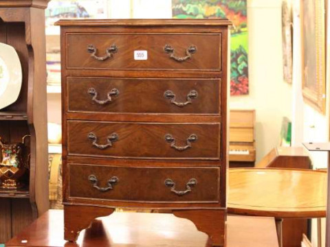 Small mahogany four drawer serpentine front chest