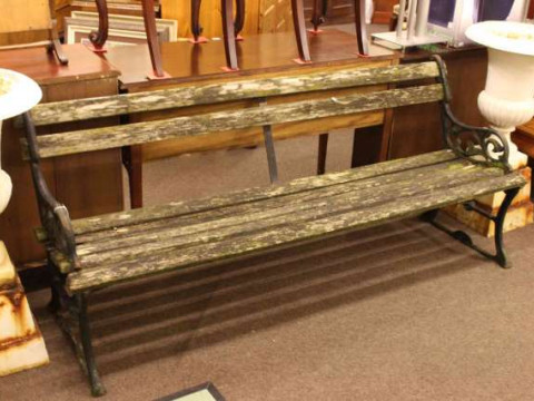 Weathered cast and wood slat garden bench