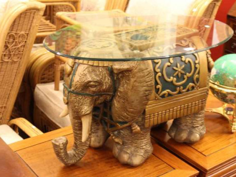 Oval glazed top elephant coffee table