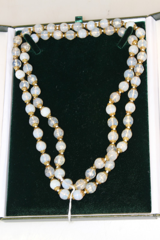 Long strand of beads, possibly moonstones