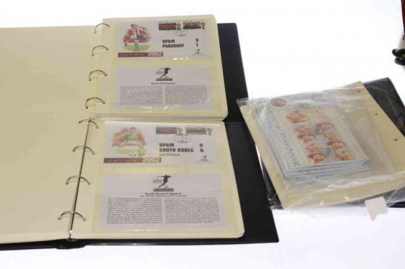 Two World Cup 2002 stamp albums, empty album and Marilyn Monroe 50th Anniversary packs