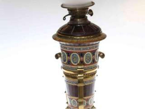 High quality brass and pottery (Metlach) oil lamp, the decorated vase...