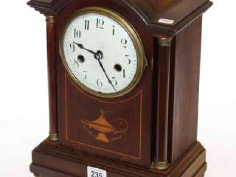 Inlaid mahogany striking mantel clock