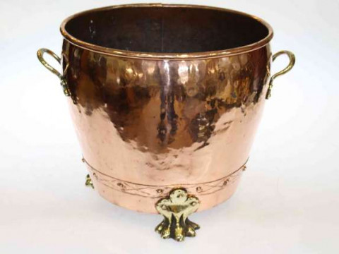 Large copper planter with brass handles and feet