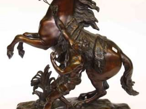 Bronze rearing horse and minder