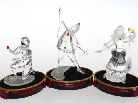 Three Swarovski crystalline figures of Harlequin, Pierot and Columbine,...