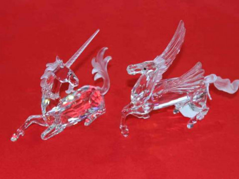 Two Swarovski boxed models of Unicorn and Pegasus