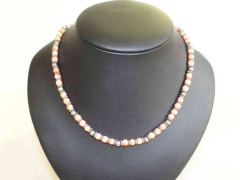 Beaded necklace of coral and silver coloured beads
