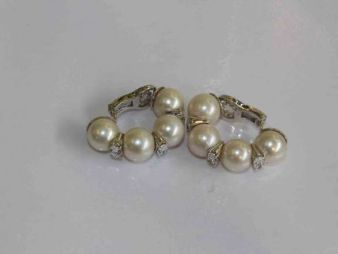 Pair of cultured pearl and marquise diamond ear clips, the diamond weight...