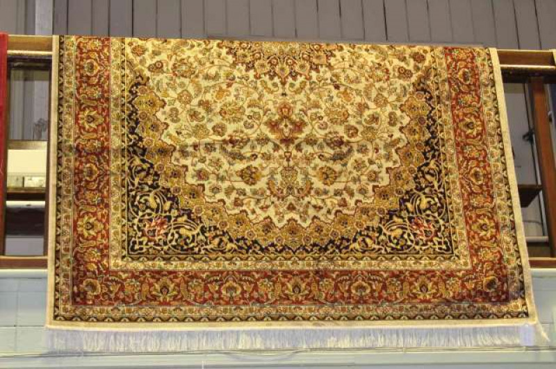 Keshan carpet with a beige ground. 2.30m x 1.60m
