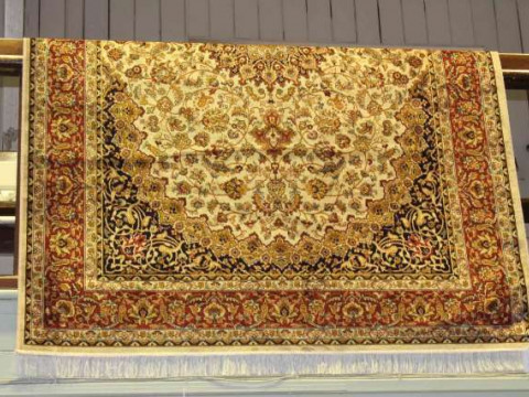 Keshan carpet with a beige ground. 2.30m x 1.60m