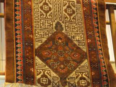 Persian design rug with a brown ground. 2.10m x 1.02m