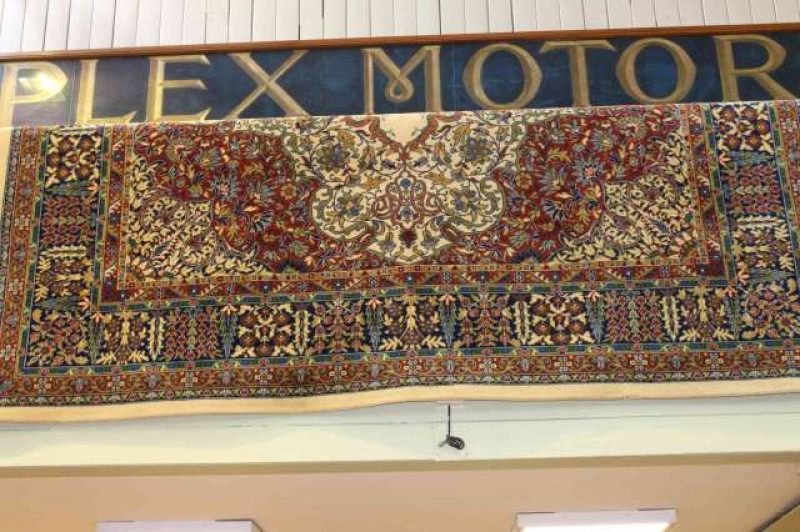 Traditional carpet with a fawn ground. 3.60m x 2.75m