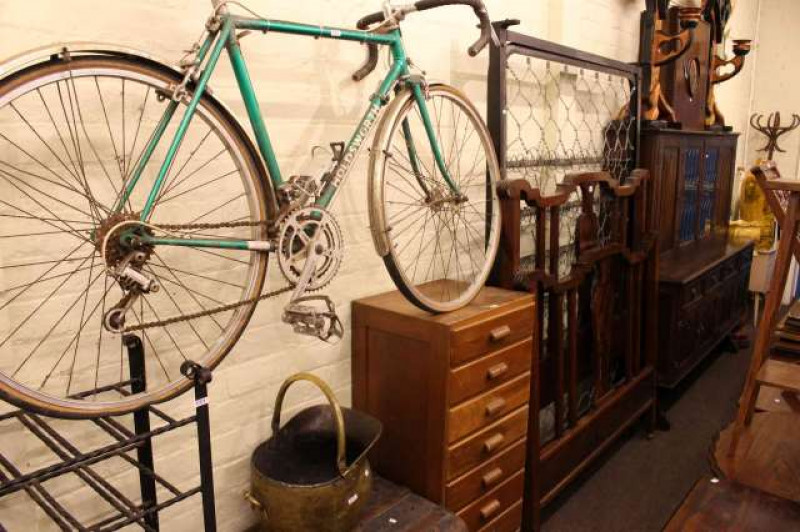 Edwardian mahogany double bedstead, eight drawer oak chest, Holdsworth racing cycle, brass coal helmet, tin trunk and wrought iron wine rack