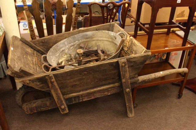 Vintage manual vertical drill, wooden wheelbarrow, tin bath and contents