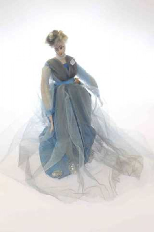 Vintage doll in elegant dress