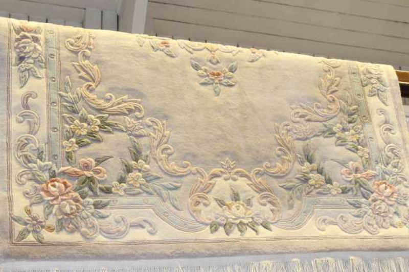 Chinese carpet with floral decoration on fawn ground, 2.90m x 1.80m