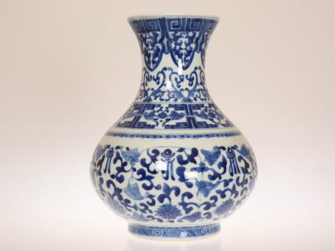 A CHINESE BLUE AND WHITE PORCELAIN VASE, of baluster form, painted with...