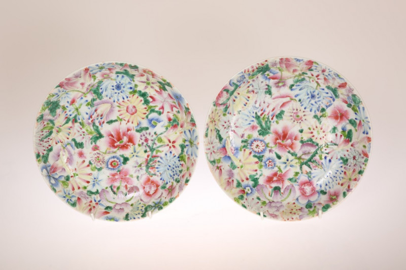 A PAIR OF CHINESE FAMILLE ROSE MILLEFIORE PORCELAIN DISHES, on a white ground, with iron red four character mark and bamboo sprays. 23.25cm 