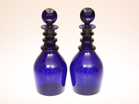 A PAIR OF COBALT BLUE GLASS GIN AND RUM DECANTERS, EARLY 19th CENTURY,...