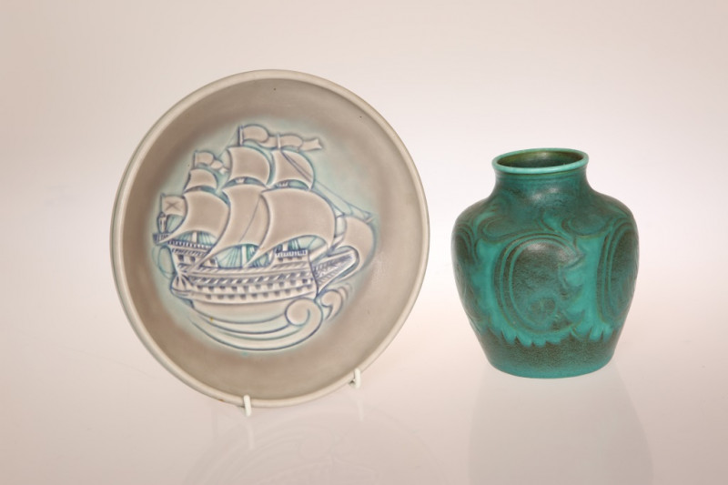 A PILKINGTONS ROYAL LANCASTRIAN BOWL, bearing monogram for William Mycock, in a matt glaze, the well decorated with a galleon in full sail, impressed marks; together with a Pilkingtons Royal Lancastrian vase, in a matt bottle green glaze, decorated with s