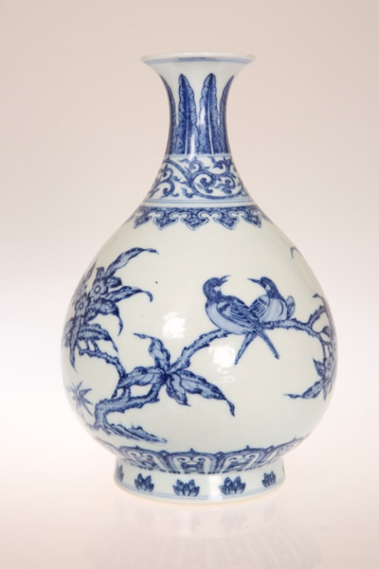 A MING STYLE 'BIRD AND FLOWER' YUHUCHUNPING VASE, blue painted with birds on blossoming branches. 25cm